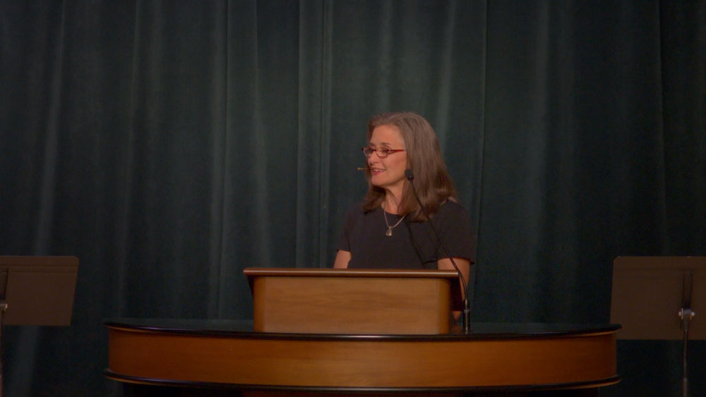 Dawn Williams speaking at chapel podium