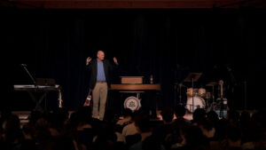 josh beers standing on chapel stage