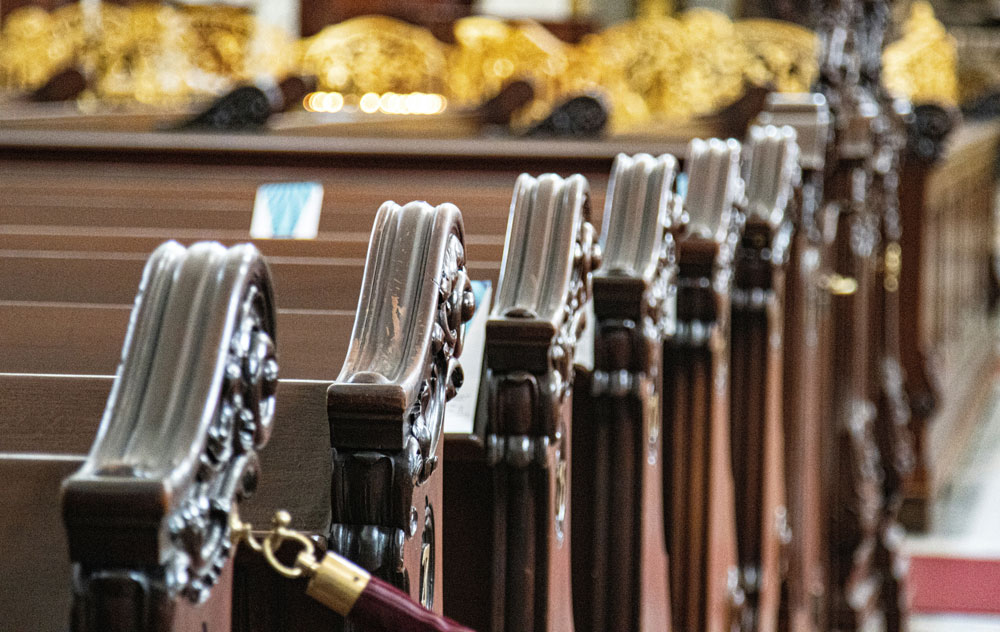 up-close image of empty church pews