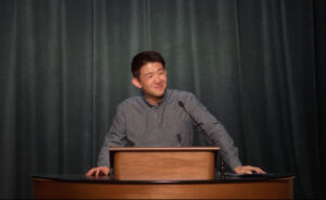 Jin Lee standing at chapel podium