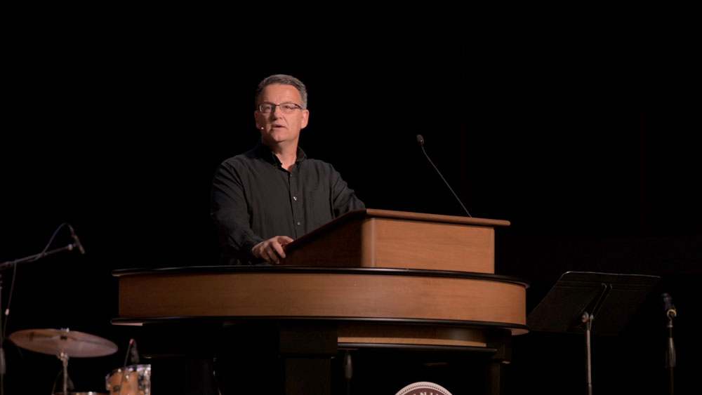 Al Rossi standing at chapel podium