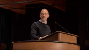 Kevin McFadden standing at chapel podium