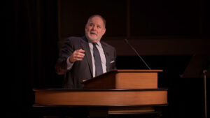 Todd Williams standing behind chapel podium