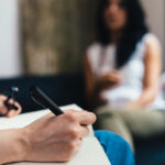 a woman sitting at a counseling session