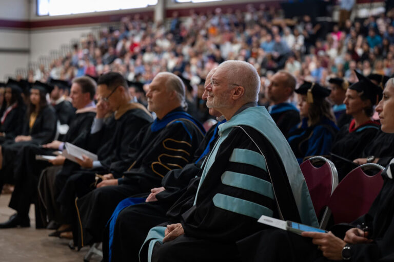 faculty in regalia at a commencement ceremony