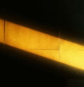 image of a beam of light on a dark wall
