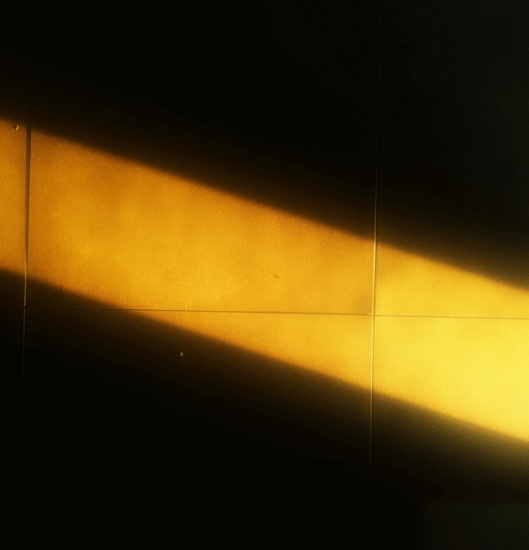 image of a beam of light on a dark wall