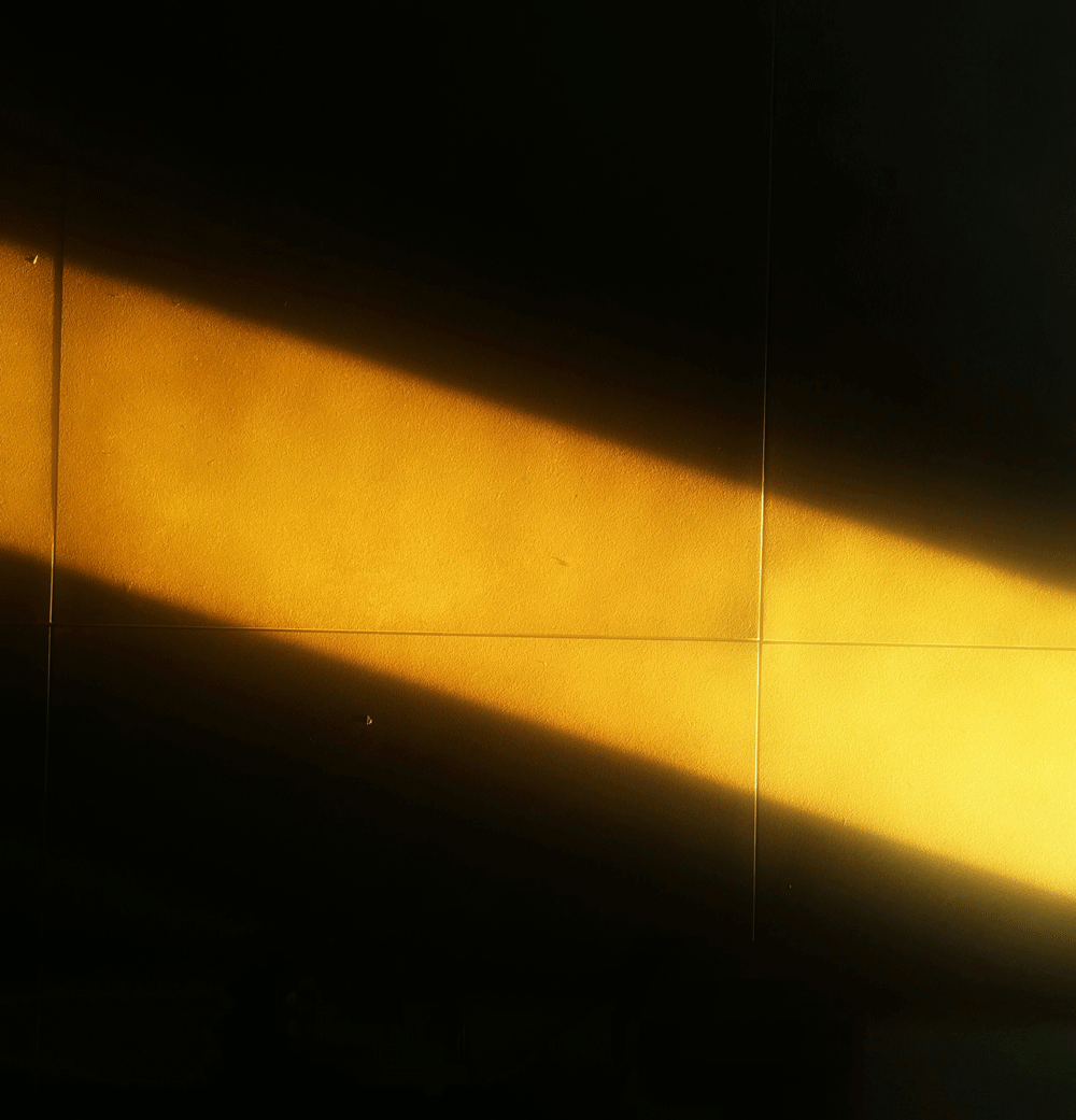 image of a beam of light on a dark wall