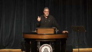 Rob Burns behind chapel podium
