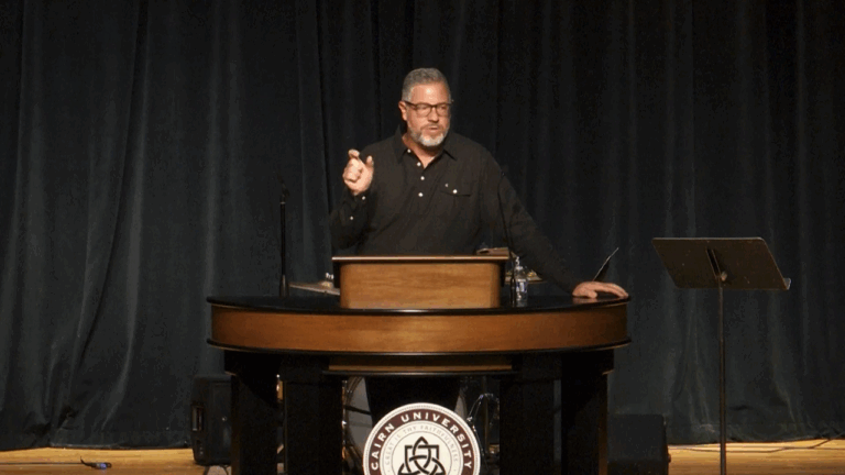 Rob Burns behind chapel podium