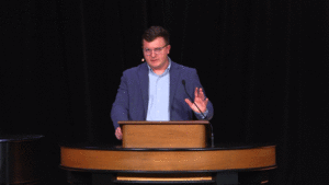 Andrew Gordon behind chapel podium