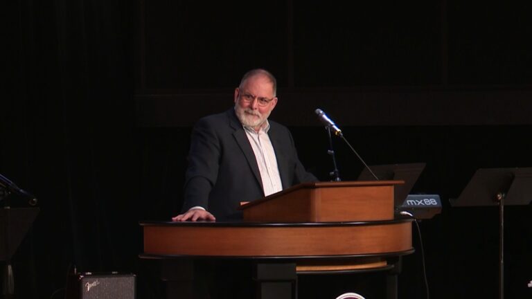 Todd Williams behind chapel podium