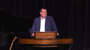 Andrew Gordon behind chapel podium