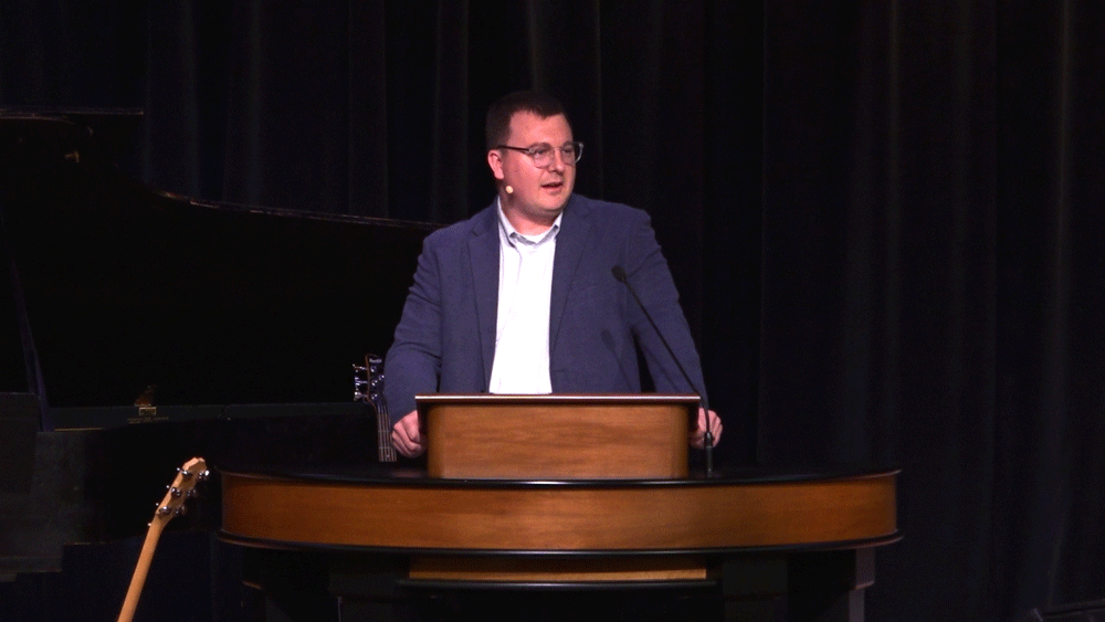 Andrew Gordon behind chapel podium