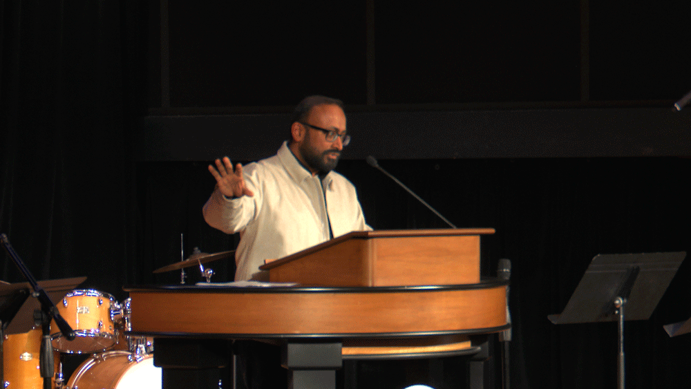Ajay Thomas behind the chapel podium