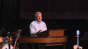 Matt McAlack behind chapel podium