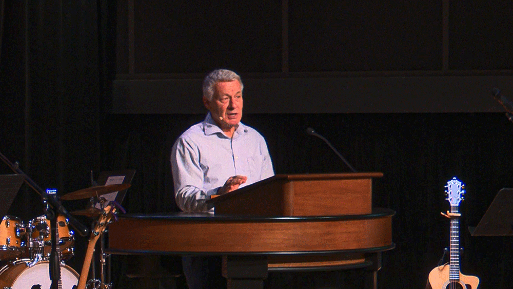 Matt McAlack behind chapel podium
