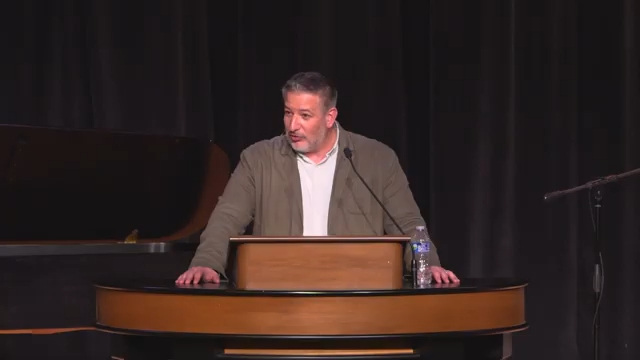Dr. Jared Wilson behind chapel podium