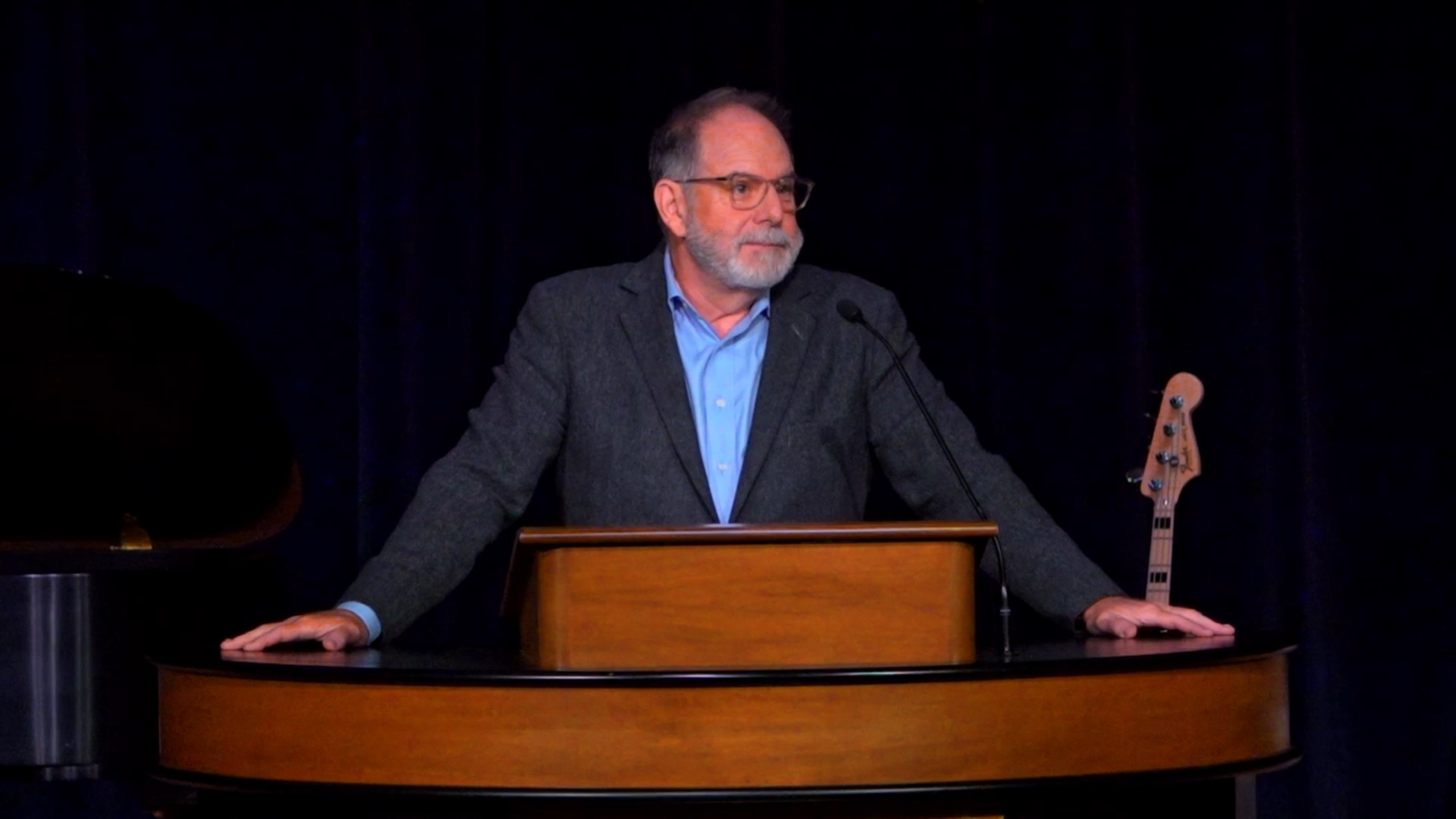 Dr. Williams standing behind chapel podium