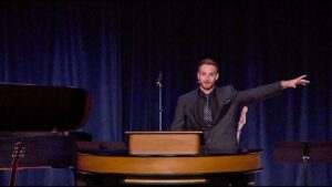 Jesse Stokes standing behind chapel podium