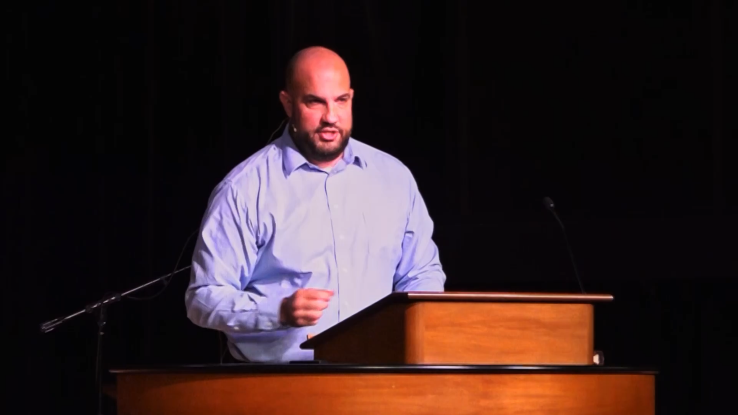 Adam Crain behind chapel podium
