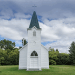 image of a small white church building with a steeple